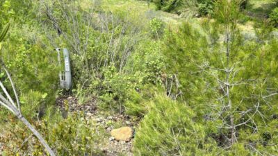 Muğla'nın Dalaman ilçesinde kayıp olarak aranan muhtarın uçuruma devrilen otomobilde