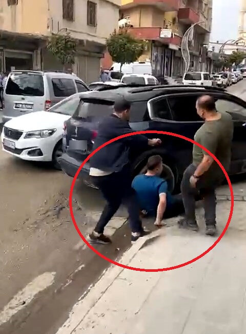 Tartıştığı kişinin ayaklarını cipinin altında ezerek geri manevra yapan sürücü,