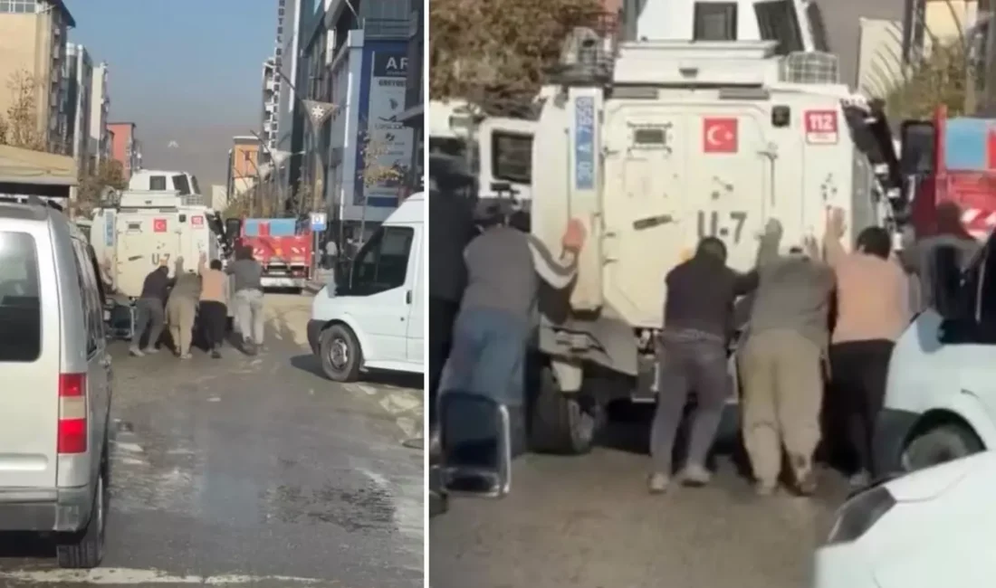 Hakkari’de Yolda arızalanan zırhlı polis aracına çevredeki vatandaşlar yardım etti.