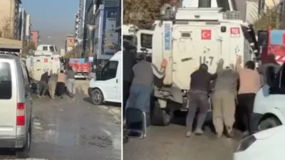 Hakkari’de Yolda arızalanan zırhlı polis aracına çevredeki vatandaşlar yardım etti.