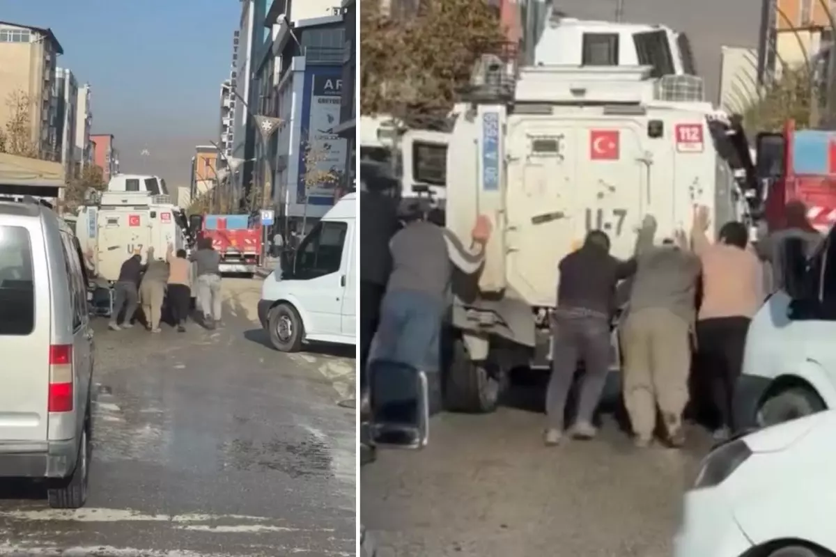 Hakkari’de Yolda arızalanan zırhlı polis aracına çevredeki vatandaşlar yardım etti.