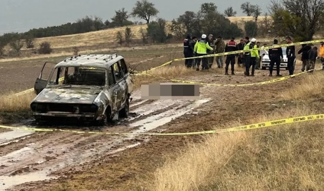 Isparta'da dağlık alanda yanmış bir aracın yakınında, baş kısmı olmayan