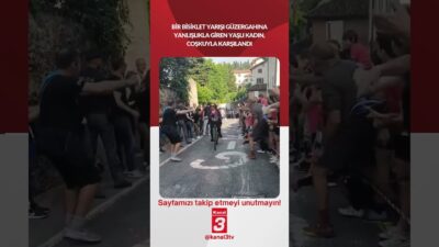 Bir bisiklet yarışı güzergahına yanlışlıkla giren yaşlı kadın, coşkuyla karşılandı!