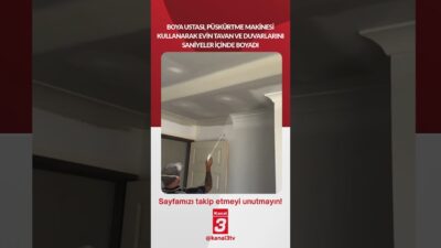 Boya ustası, püskürtme makinesi kullanarak evin tavan ve duvarlarını saniyeler