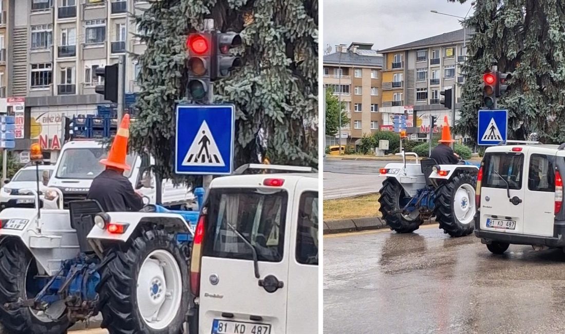 Bolu'da sağanak sırasında yağmurdan korunmak isteyen traktör sürücüsü, başına trafik