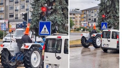 Bolu'da sağanak sırasında yağmurdan korunmak isteyen traktör sürücüsü, başına trafik