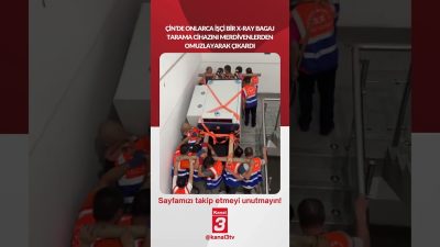 Çin’de onlarca işçi dev bir X-ray bagaj tarama cihazını merdivenlerden