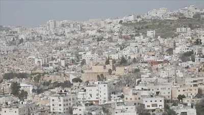 İşgal altındaki Batı Şeria'da Filistin topraklarını gasbeden İsraillilerin Filistinlilere ve