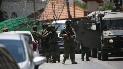 İsrail güçleri ve Filistin topraklarını gasbeden İsraillilerin, işgal altındaki Batı