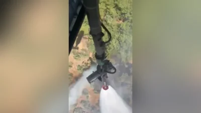 Balıkesir'in Edremit ilçesinde arazide başlayıp ormana sıçrayan yangının söndürülmesi için
